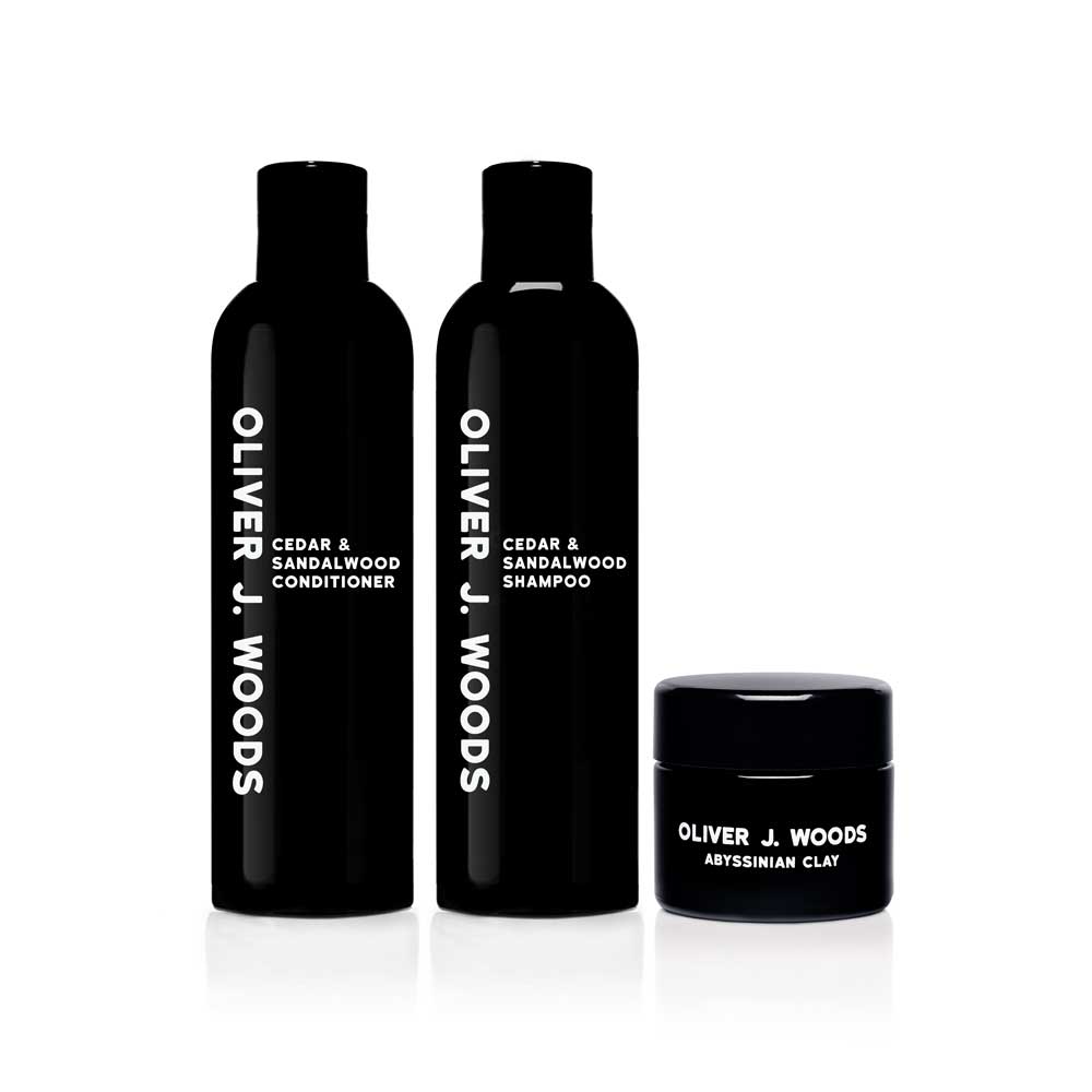 A set of luxury men's grooming products including Cedar & Sandalwood Shampoo and Conditioner, plus our light malleable Abyssinian Clay
